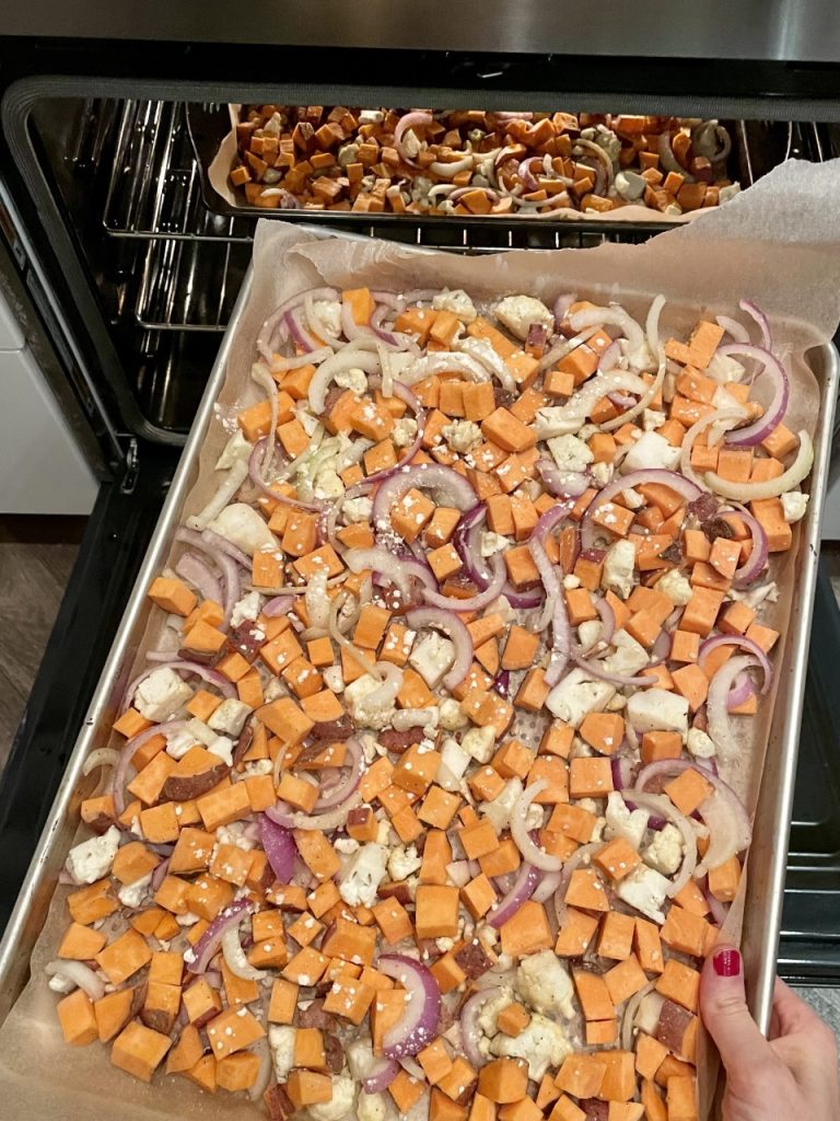 Baking Sheet of Sweet Potatoes ,Cauliflower, and Onions